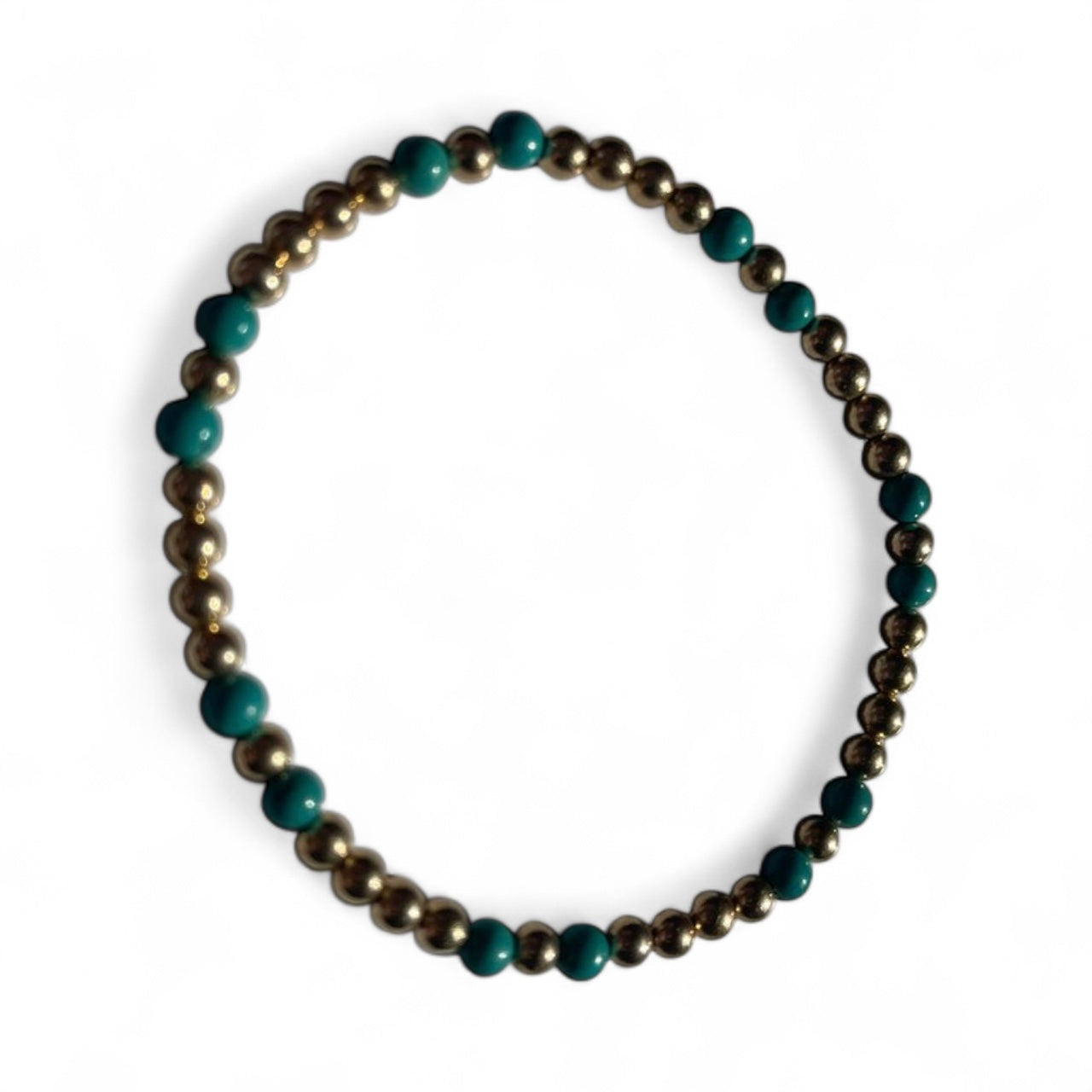 Luxury turquoise and gold filled crystal bracelet symbolising wisdom and protection.