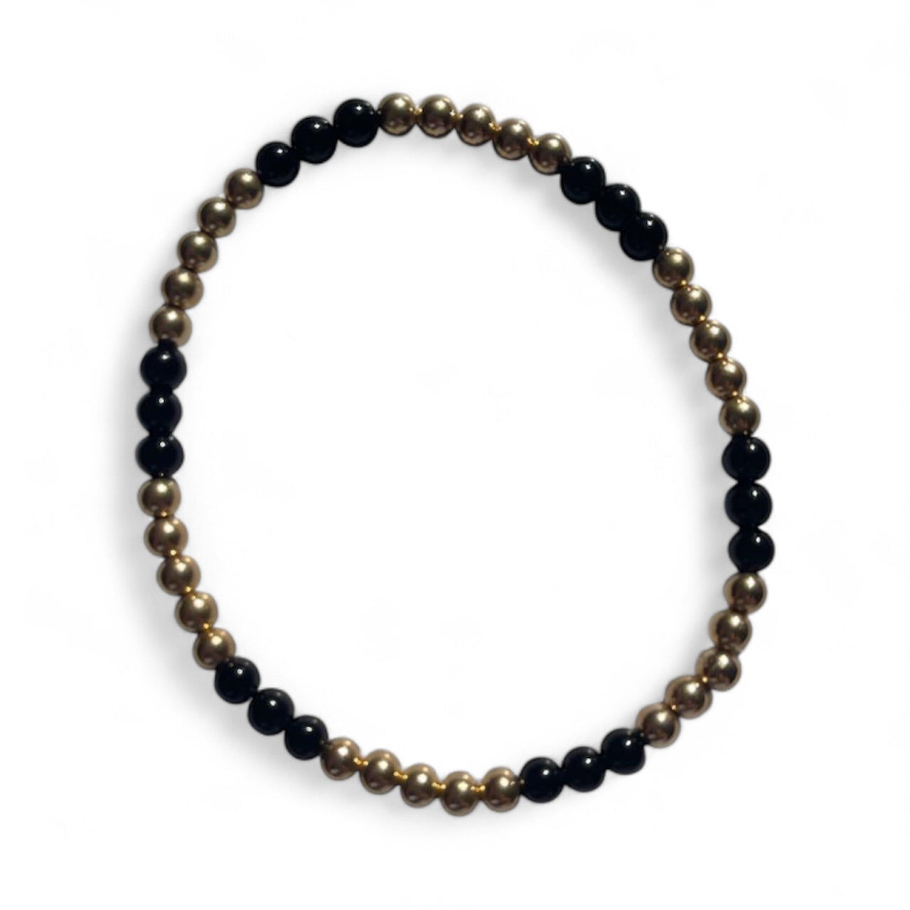 Luxury crystal bracelet featuring onyx and gold filled beads, symbolising strength and protection.