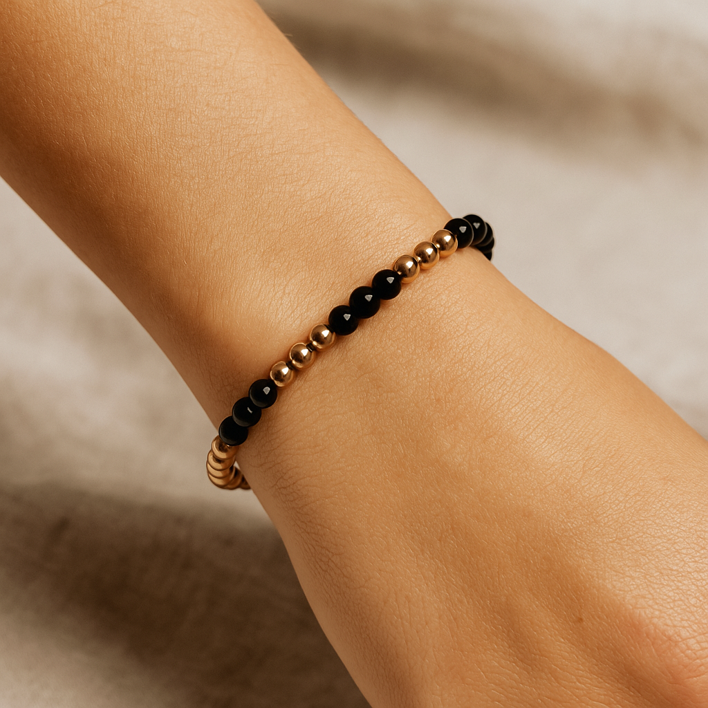 Elegant handmade bracelet with gold and onyx beads, grounding and empowering jewellery