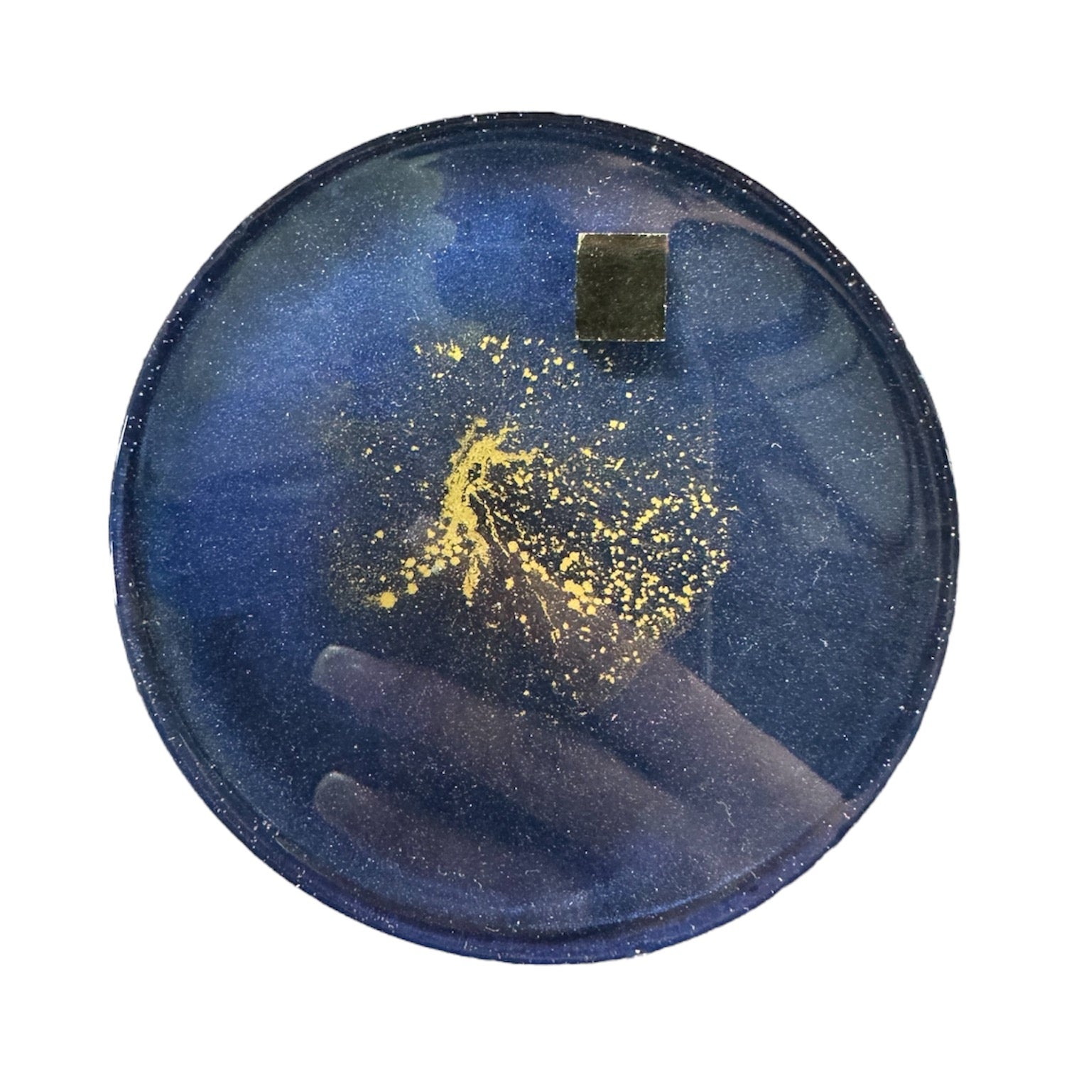Handmade navy resin coaster with gold and pyrite detailing, circular shape.