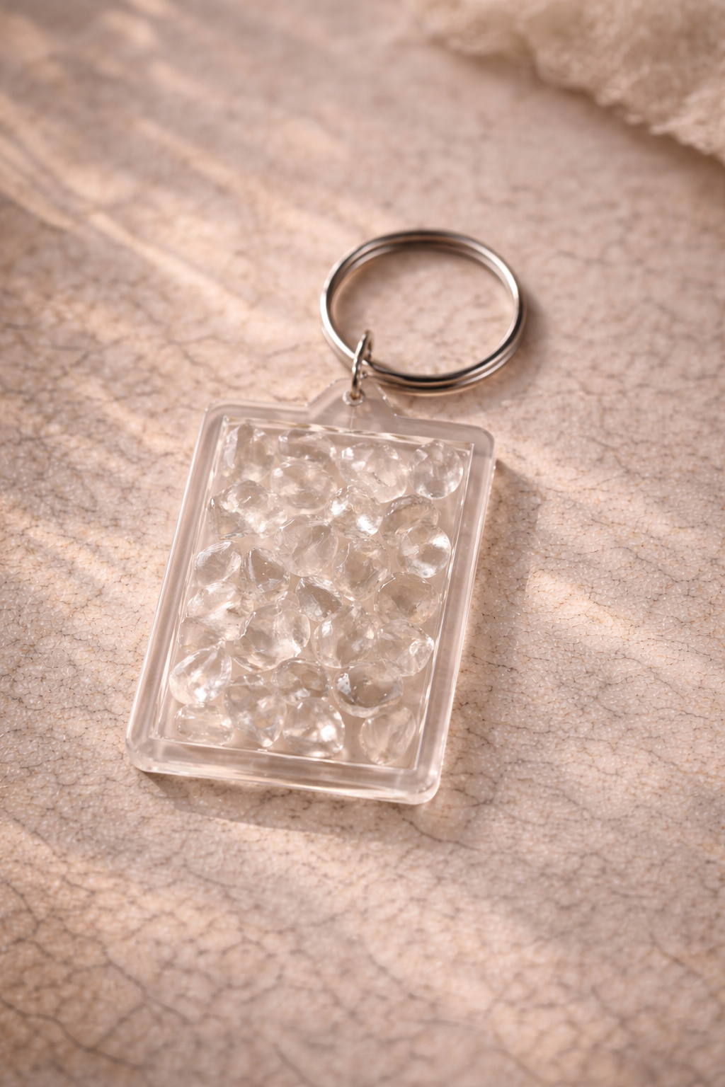Pocket Energy Keyring with clear quartz crystal chips, known for clarity and amplifying intention.